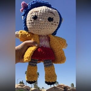 Coraline in crochet – a tiny world of mystery, stitched with love.”💗